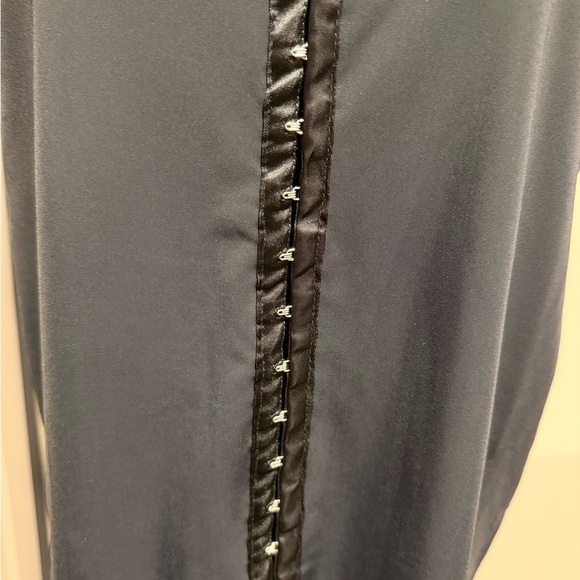 Chic Black Sleeveless Blouse with Satin Detail - Picture 2 of 6